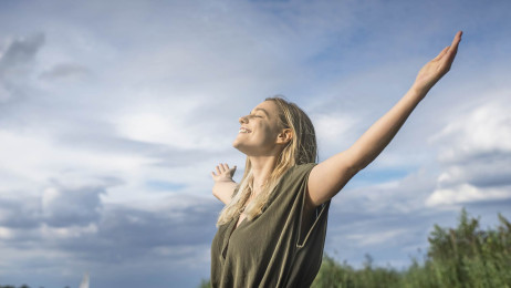 woman with raised arms